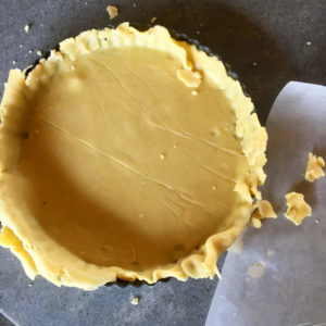 Uncooked Sweet butter shortcrust pastry after rolling out and lining a tart tin